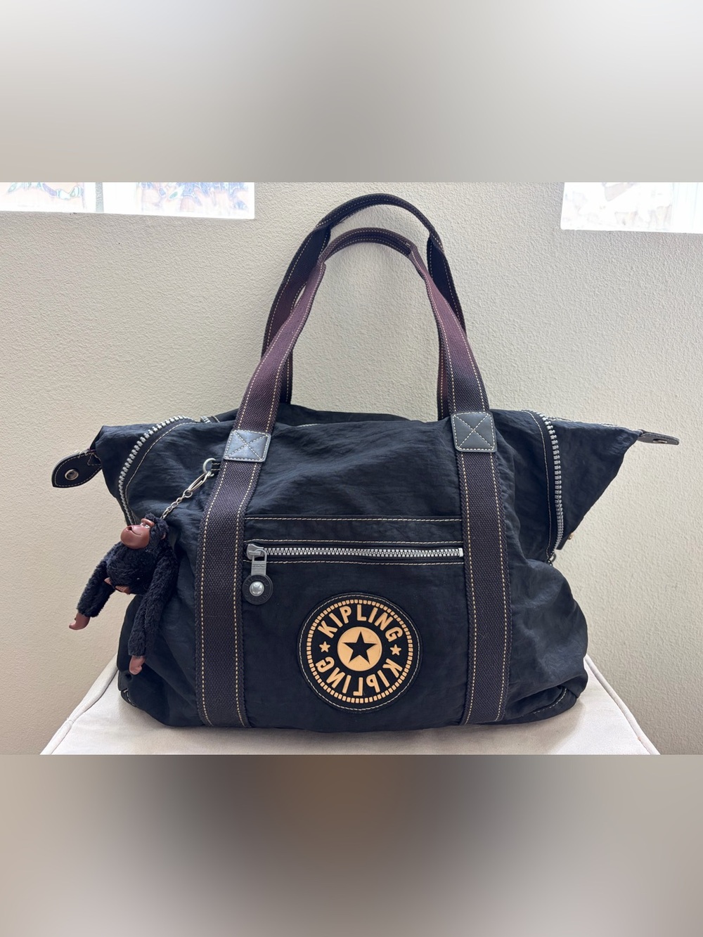 Kipling Black Duffel Bag with Tan Logo Accent